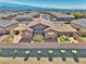 Aerial view of home showcasing the private backyard with patio and landscaping in a well-maintained neighborhood at 5460 Chippewa, Pahrump, NV 89061