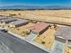 Aerial view showcasing the home's desert landscaping, long driveway, and mountain views in the distance at 5460 Chippewa, Pahrump, NV 89061