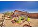 Spacious backyard featuring desert landscaping, a sitting area, and a charming pergola at 5460 Chippewa, Pahrump, NV 89061