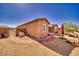Open backyard with gravel and brick landscaping offering a low maintenance outdoor space at 5460 Chippewa, Pahrump, NV 89061