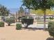Community park features a playground and park bench with mature landscaping for a great recreational area at 5460 Chippewa, Pahrump, NV 89061