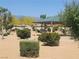 Community park features a shaded picnic area, lush landscaping and walking paths with mountain views at 5460 Chippewa, Pahrump, NV 89061