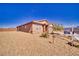 Charming home showcasing desert landscaping, a two-car garage, and a well-kept front yard at 5460 Chippewa, Pahrump, NV 89061