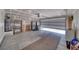 Spacious two car garage with an open garage door, ample room for storage, and concrete flooring at 5460 Chippewa, Pahrump, NV 89061