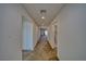 Bright hallway with neutral carpet, leading to various rooms in the house at 5460 Chippewa, Pahrump, NV 89061