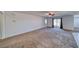 Spacious living room with neutral carpet that has seamless access to the bright kitchen at 5460 Chippewa, Pahrump, NV 89061