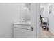 Bathroom featuring a vanity, mirror, and essential toiletries with neutral decor and a warm ambiance at 55 Strada Fontana, Henderson, NV 89011