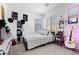 Bright bedroom featuring a comfy bed, neutral decor, and stylish personal touches at 55 Strada Fontana, Henderson, NV 89011