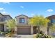 Charming two-story home with a two-car garage and well-maintained landscaping at 55 Strada Fontana, Henderson, NV 89011
