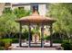 Beautiful gazebo with fountain in the center, surrounded by trimmed hedges and olive trees at 55 Strada Fontana, Henderson, NV 89011