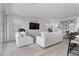 Bright and airy living room featuring stylish furnishings and an open floor plan at 55 Strada Fontana, Henderson, NV 89011