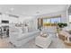 Bright and airy living room featuring stylish furnishings and an open floor plan with kitchen at 55 Strada Fontana, Henderson, NV 89011