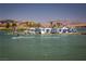 Inflatable water park featuring climbing walls, slides, and other fun activities for the whole Gathering at 55 Strada Fontana, Henderson, NV 89011