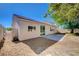 The backyard shows rock landscaping, a small patio, and a view of the home at 5622 Sage Pines Dr, Las Vegas, NV 89118