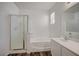 Bright bathroom featuring a sink vanity, a shower, and a bathtub at 5622 Sage Pines Dr, Las Vegas, NV 89118