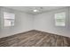 Bright bedroom showcasing hardwood flooring, ceiling fan, and large windows at 5622 Sage Pines Dr, Las Vegas, NV 89118