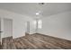 Bright bedroom featuring hardwood flooring, ceiling fan, and ample closet space at 5622 Sage Pines Dr, Las Vegas, NV 89118