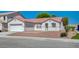 Charming single-story home with a well-maintained exterior, attached garage and desert landscaping at 5622 Sage Pines Dr, Las Vegas, NV 89118