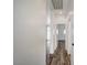 A bright hallway with wood-look flooring leads to other rooms in the house at 5622 Sage Pines Dr, Las Vegas, NV 89118