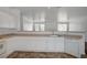 Well-lit kitchen with white cabinets, tile floors, and stainless-steel appliances at 5622 Sage Pines Dr, Las Vegas, NV 89118