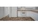 Clean kitchen featuring white appliances, light counter tops, and tile flooring at 5622 Sage Pines Dr, Las Vegas, NV 89118