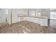 Functional kitchen with white cabinets, appliances, and open access to living areas at 5622 Sage Pines Dr, Las Vegas, NV 89118