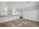 Bright kitchen featuring white cabinetry, tile flooring and stainless steel dishwasher at 5622 Sage Pines Dr, Las Vegas, NV 89118