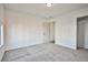 This bedroom features neutral carpet, white walls, and closet at 603 W Adams Ave, Las Vegas, NV 89106