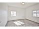 Bedroom features new carpet, neutral paint, and natural light at 603 W Adams Ave, Las Vegas, NV 89106