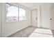 Bedroom features new carpet, neutral paint, and large window at 603 W Adams Ave, Las Vegas, NV 89106