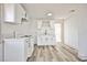 Renovated kitchen features white cabinets, quartz countertops, and stainless appliances at 603 W Adams Ave, Las Vegas, NV 89106