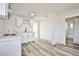 Bright kitchen features white cabinetry, stainless steel appliances, and quartz countertops at 603 W Adams Ave, Las Vegas, NV 89106