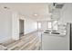 Open living room features new laminate flooring, fresh white paint, and modern lighting at 603 W Adams Ave, Las Vegas, NV 89106