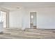 Bright living room featuring plank floors, fresh white paint, and an open floor plan at 603 W Adams Ave, Las Vegas, NV 89106