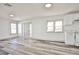 Bright living room featuring plank floors, fresh white paint, and an open floor plan at 603 W Adams Ave, Las Vegas, NV 89106