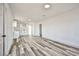 Bright living room featuring plank floors, fresh white paint, and an open floor plan at 603 W Adams Ave, Las Vegas, NV 89106