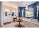 Luxurious bathroom featuring a soaking tub, vanity area, and stylish fixtures at 6060 N Conquistador St, Las Vegas, NV 89149