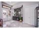 Elegant foyer with black accent wall, double doors, and marble floors at 6060 N Conquistador St, Las Vegas, NV 89149