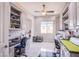 Well-organized office with custom cabinets, and durable floors at 6060 N Conquistador St, Las Vegas, NV 89149
