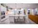 Open concept kitchen featuring quartz counters, a large island, and stainless-steel appliances at 6060 N Conquistador St, Las Vegas, NV 89149