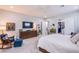 Serene bedroom features soft colors, a ceiling fan, and a large walk-in closet at 6060 N Conquistador St, Las Vegas, NV 89149