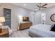 Comfortable main bedroom boasts modern furnishings, stylish decor, and an ensuite bathroom for added convenience at 6060 N Conquistador St, Las Vegas, NV 89149