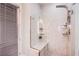 Modern walk-in shower features glass enclosure, rain shower head, and built-in bench at 6060 N Conquistador St, Las Vegas, NV 89149