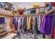 Well-organized walk-in closet providing ample storage space with hanging racks and shelving units at 6060 N Conquistador St, Las Vegas, NV 89149