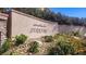 Decorative community sign for Serrano, with lush landscaping and stone accents at 628 Chervil Valley Dr, Las Vegas, NV 89138