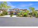 Elegant home with two-car garage, manicured landscaping, and a beautiful tile roof at 628 Chervil Valley Dr, Las Vegas, NV 89138