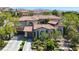 Stunning two-story home with a tile roof, well-manicured front yard, and a two-car garage at 628 Chervil Valley Dr, Las Vegas, NV 89138