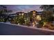 Home exterior at dusk featuring stone steps with lights leading to the front entrance at 628 Chervil Valley Dr, Las Vegas, NV 89138