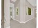 Bright foyer featuring tile flooring, high ceilings, and natural light from large windows at 628 Chervil Valley Dr, Las Vegas, NV 89138