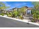 Elegant home exterior with stone accents and desert landscaping at 628 Chervil Valley Dr, Las Vegas, NV 89138